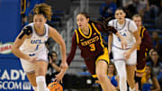 Feb 2, 2025; Los Angeles, California, USA; Minnesota Golden Gophers guard Amaya Battle (3) dribbles the ball up the court between UCLA Bruins guard Kiki Rice (1) and Lauren Betts (51) during the second quarter at Pauley Pavilion presented by Wescom. Mandatory Credit: Robert Hanashiro-Imagn Images