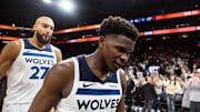 Nov 21, 2025; Phoenix, Arizona, USA; Minnesota Timberwolves guard Anthony Edwards (5) and center Rudy Gobert (27) react as they walk off the court after losing to the Phoenix Suns in the second half of an NBA Cup game at Mortgage Matchup Center. Mandatory Credit: Mark J. Rebilas-Imagn Images