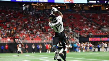 Aug 23, 2024; Atlanta, Georgia, USA; Jacksonville Jaguars tight end Evan Engram (17) catches a touchdown pass past Atlanta Falcons cornerback Anthony Johnson (43) in the second quarter at Mercedes-Benz Stadium. Mandatory Credit: Brett Davis-Imagn Images