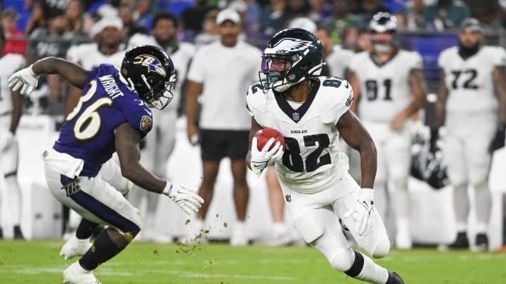 Aug 9, 2024; Baltimore, Maryland, USA; Philadelphia Eagles wide receiver Ainias Smith (82) returns a punt as Baltimore Ravens running back Owen Wright (36)  defends during the second half of a preseason game at M&T Bank Stadium. Tommy Gilligan-USA TODAY Sports