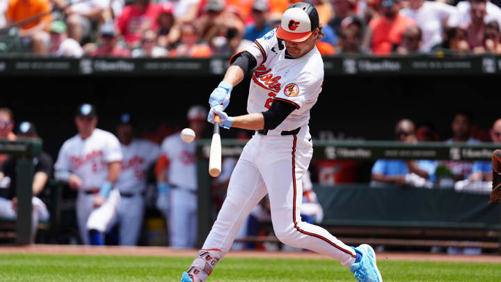 Jun 16, 2024; Baltimore, Maryland, USA; Baltimore Orioles shortstop Gunnar Henderson (2) hits a home run against the Philadelphia Phillies during the first inning at Oriole Park at Camden Yards.