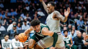 Michigan State forward Malik Hall (25) dribbles against Mississippi State forward Jimmy Bell Jr. (15) during the second half of NCAA tournament West Region first round at Spectrum Center in Charlotte, N.C. on Thursday, March 21, 2024.