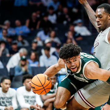 Michigan State forward Malik Hall (25) dribbles against Mississippi State forward Jimmy Bell Jr. (15) during the second half of NCAA tournament West Region first round at Spectrum Center in Charlotte, N.C. on Thursday, March 21, 2024.