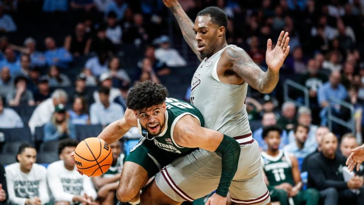 Michigan State forward Malik Hall (25) dribbles against Mississippi State forward Jimmy Bell Jr. (15) during the second half of NCAA tournament West Region first round at Spectrum Center in Charlotte, N.C. on Thursday, March 21, 2024.