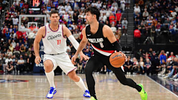 Oct 26, 2025; Inglewood, California, USA; Portland Trail Blazers forward Deni Avdija (8) moves the ball against Los Angeles Clippers center Brook Lopez (11) during the second half at Intuit Dome. Mandatory Credit: Gary A. Vasquez-Imagn Images