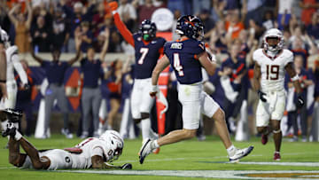 Sep 26, 2025; Charlottesville, Virginia, USA; Virginia Cavaliers quarterback Chandler Morris (4) scores a touchdown against the Florida State Seminoles at Scott Stadium. Mandatory Credit: Geoff Burke-Imagn Images