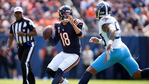 Chicago Bears quarterback Caleb Williams  plants to throw against the Tennessee Titans 