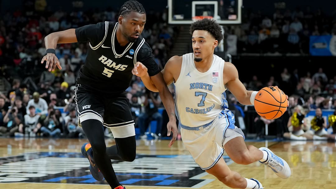 Mar 19, 2026; Greenville, SC, USA; North Carolina Tar Heels guard Seth Trimble (7) dribbles against VCU Rams forward Barry Evans (5) in the second half of a first round game of the men's 2026 NCAA Tournament at Bon Secours Wellness Arena. Mandatory Credit: Bob Donnan-Imagn Images