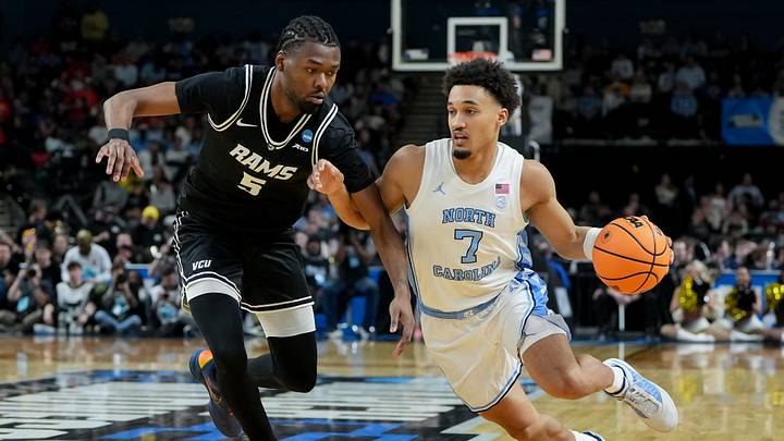 Mar 19, 2026; Greenville, SC, USA; North Carolina Tar Heels guard Seth Trimble (7) dribbles against VCU Rams forward Barry Evans (5) in the second half of a first round game of the men's 2026 NCAA Tournament at Bon Secours Wellness Arena. Mandatory Credit: Bob Donnan-Imagn Images