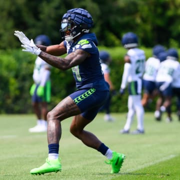 Jul 27, 2024; Renton, WA, USA; Seattle Seahawks wide receiver DK Metcalf (14) catches a pass during training camp at Virginia Mason Athletic Center.