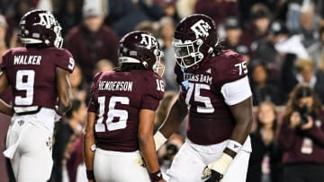 Nov 11, 2023; College Station, Texas, USA; Texas A&M Aggies offensive lineman Kam Dewberry (75) celebrates with quarterback Jaylen Henderson (16) after a touchdown during the first quarter against the Mississippi State Bulldogs at Kyle Field. Mandatory Credit: Maria Lysaker-USA TODAY Sports