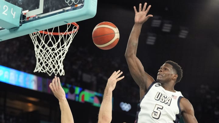 Aug 8, 2024; Paris, France; United States guard Anthony Edwards (5) blocks the shot of Serbia point guard Vasilije Micic (22) during the first half in a men's basketball semifinal game during the Paris 2024 Olympic Summer Games at Accor Arena. Mandatory Credit: Kyle Terada-USA TODAY Sports