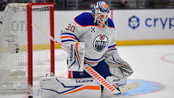 Apr 29, 2025; Los Angeles, California, USA; Edmonton Oilers goaltender Calvin Pickard (30) blocks a shot against the Los Angeles Kings during the second period in game five of the first round of the 2025 Stanley Cup Playoffs at Crypto.com Arena. Mandatory Credit: Gary A. Vasquez-Imagn Images