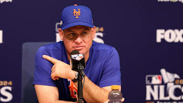 Oct 13, 2024; Los Angeles, California, USA; New York Mets manager Carlos Mendoza (64) speaks to the media before game one of the NLCS for the 2024 MLB Playoffs at Dodger Stadium. Mandatory Credit: Kiyoshi Mio-Imagn Images