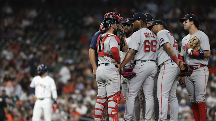 Mar 31, 2026; Houston, Texas, USA;  Boston Red Sox starting pitcher Brayan Bello (66) gets a mound visit against the Houston Astros in the fifth inning at Daikin Park. Mandatory Credit: Thomas Shea-Imagn Images