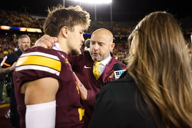 Minnesota Golden Gophers head coach P.J. Fleck and defensive back Koi Perich (3) are interviewed after the game