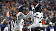 Nov 8, 2025; Charlottesville, Virginia, USA; Wake Forest Demon Deacons cornerback Braylon Johnson (23) celebrates with Demon Deacons safety Lardarius Webb Jr. (20) after blocking a touchdown pass during the final seconds of the second half against the Virginia Cavaliers at Scott Stadium. Mandatory Credit: Amber Searls-Imagn Images