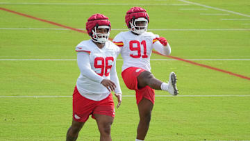 Jul 22, 2025; St. Joseph, MO, USA; Kansas City Chiefs defensive tackle Fabien Lovett Sr. (96) and defensive end Felix Anudike-Uzomah (91) stretch out during training camp at Missouri Western State University. Mandatory Credit: Denny Medley-Imagn Images