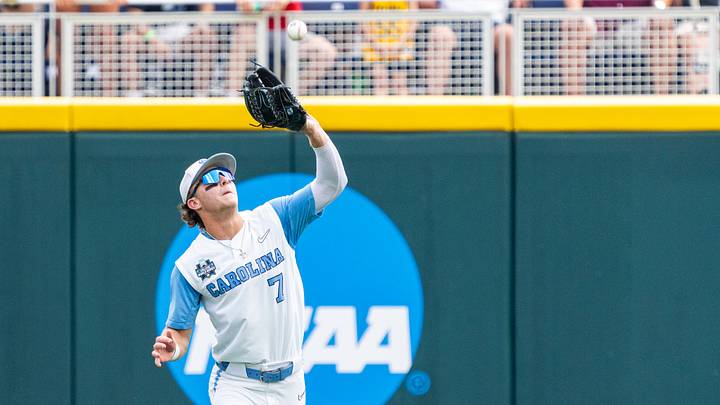 Jun 18, 2024; Omaha, NE, USA; North Carolina Tar Heels center fielder Vance Honeycutt (7) catches a fly ball for an out against the Florida State Seminoles during the fifth inning at Charles Schwab Field Omaha. Mandatory Credit: Dylan Widger-USA TODAY Sports