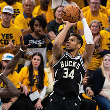 Apr 29, 2025; Indianapolis, Indiana, USA; Milwaukee Bucks forward Giannis Antetokounmpo (34) shoots the ball while  Indiana Pacers forward Pascal Siakam (43) defends during game five of the first round for the 2024 NBA Playoffs at Gainbridge Fieldhouse. Mandatory Credit: Trevor Ruszkowski-Imagn Images