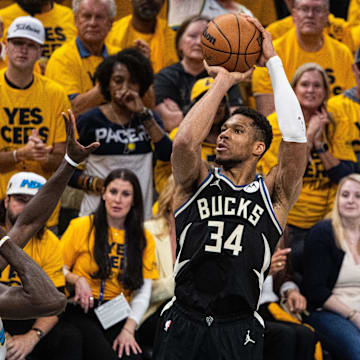 Apr 29, 2025; Indianapolis, Indiana, USA; Milwaukee Bucks forward Giannis Antetokounmpo (34) shoots the ball while  Indiana Pacers forward Pascal Siakam (43) defends during game five of the first round for the 2024 NBA Playoffs at Gainbridge Fieldhouse. Mandatory Credit: Trevor Ruszkowski-Imagn Images