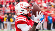 Nebraska Cornhuskers running back Kwinten Ives catches a kickoff against the UCLA Bruins.