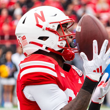 Nebraska Cornhuskers running back Kwinten Ives catches a kickoff against the UCLA Bruins.