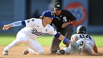 Yankees outfielder Jasson Domínguez (24) steals second base against Los Angeles Dodgers second baseman Enrique Hernández (8) during the fifth inning at Dodger Stadium.