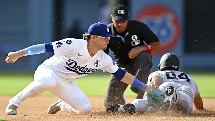 Yankees outfielder Jasson Domínguez (24) steals second base against Los Angeles Dodgers second baseman Enrique Hernández (8) during the fifth inning at Dodger Stadium.