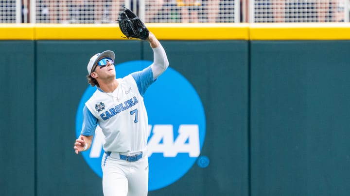 Jun 18, 2024; Omaha, NE, USA; North Carolina Tar Heels center fielder Vance Honeycutt (7) catches a fly ball for an out against the Florida State Seminoles during the fifth inning at Charles Schwab Field Omaha. Mandatory Credit: Dylan Widger-USA TODAY Sports