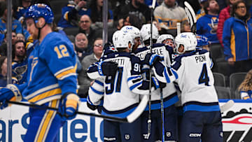 Feb 22, 2025; St. Louis, Missouri, USA; Winnipeg Jets center Gabriel Vilardi (13) celebrates with teammates after scoring agains the St. Louis Blues during the third period at Enterprise Center. Mandatory Credit: Connor Hamilton-Imagn Images