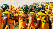 Oct 4, 2025; Waco, Texas, USA; Baylor Bears safety Jacob Redding (38) celebrates with safeties Cameren Jenkins (23) and DJ Coleman (33) after returning an interception for a touchdown against the Kansas State Wildcats during the second half at McLane Stadium. Mandatory Credit: Chris Jones-Imagn Images