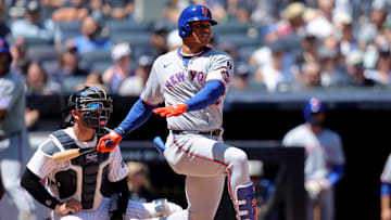 New York Mets right fielder Juan Soto (22) follows through on a single against the New York Yankees during the fourth inning at Yankee Stadium on May 17.