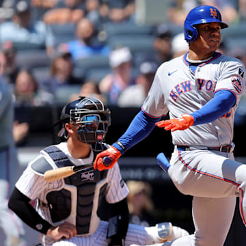 New York Mets right fielder Juan Soto (22) follows through on a single against the New York Yankees during the fourth inning at Yankee Stadium on May 17.