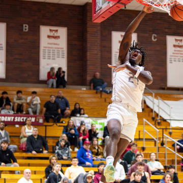 St. Joseph's Tounde Yessoufou (24) dunks the ball during the first round of the Capitol City Classic at Willamette University on Saturday, Dec. 16, 2023, in Salem, Ore.