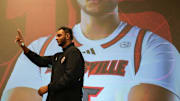 Louisville center Aly Khalifa walks towards the stage as they're introduced at the men's basketball luncheon Monday afternoon at The Galt House hotel. Oct. 7, 2024