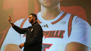 Louisville center Aly Khalifa walks towards the stage as they're introduced at the men's basketball luncheon Monday afternoon at The Galt House hotel. Oct. 7, 2024