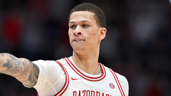 Mar 15, 2026; Nashville, TN, USA; Arkansas Razorbacks forward Trevon Brazile (7) celebrates a three-point basket towards the Vanderbilt Commodores bench in the second half during the men's SEC Conference Tournament Championship at Bridgestone Arena. Mandatory Credit: Steve Roberts-Imagn Images
