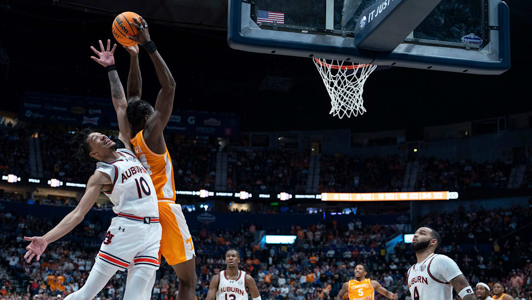 Auburn guard Chad Baker-Mazara (10) and Tennessee forward Felix Okpara (34) go up for a lob pass during the second half of their quarterfinal game of the SEC Men's Basketball Tournament at Bridgestone Arena in Nashville, Tenn., Saturday, March 15, 2025.