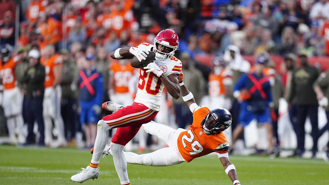 Nov 16, 2025; Denver, Colorado, USA; Kansas City Chiefs wide receiver Tyquan Thornton (80) catches the ball past Denver Broncos cornerback Ja'Quan McMillian (29) in the third quarter at Empower Field at Mile High. Mandatory Credit: Ron Chenoy-Imagn Images