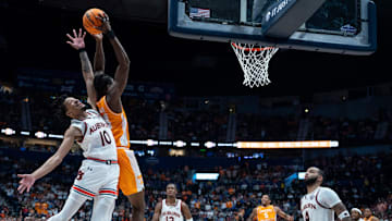 Auburn guard Chad Baker-Mazara (10) and Tennessee forward Felix Okpara (34) go up for a lob pass during the second half of their quarterfinal game of the SEC Men's Basketball Tournament at Bridgestone Arena in Nashville, Tenn., Saturday, March 15, 2025.