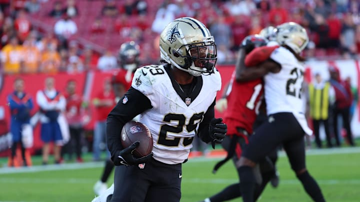 Dec 31, 2023; Tampa, Florida, USA; New Orleans Saints cornerback Paulson Adebo (29) intercepted the ball for the 2-point conversion over against the Tampa Bay Buccaneers during the second half at Raymond James Stadium. 