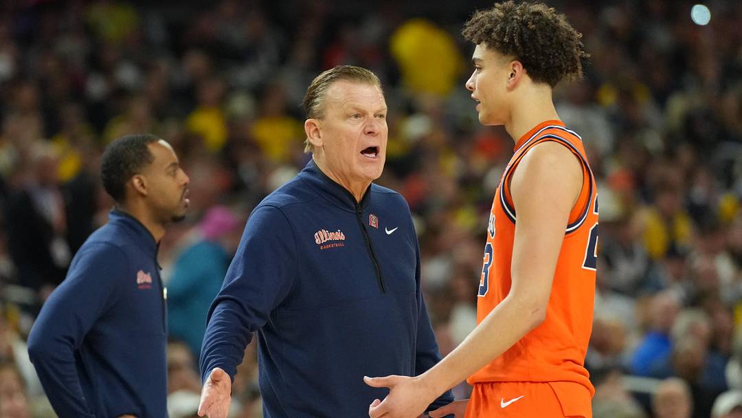 Apr 4, 2026; Indianapolis, IN, USA;  Illinois Fighting Illini head coach Brad Underwood talks with Illinois Fighting Illini guard Keaton Wagler (23) against the Connecticut Huskies in the first half during a semifinal of the Final Four of the men's 2026 NCAA Tournament at Lucas Oil Stadium. Mandatory Credit: Robert Deutsch-Imagn Images