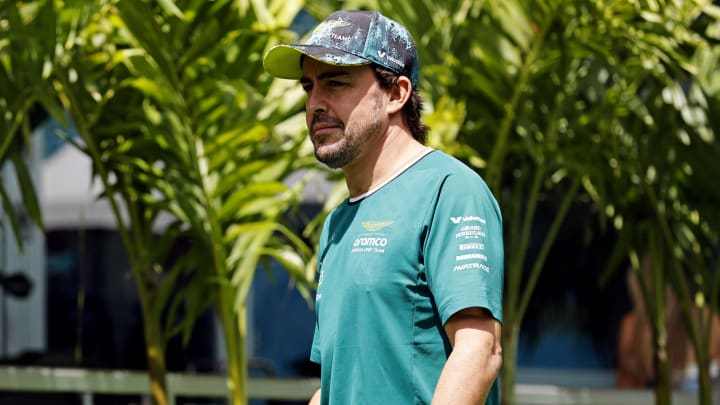 May 5, 2024; Miami Gardens, Florida, USA; Aston Matrin driver Fernando Alonso (14) walks into the F1 Village before the F1 Miami Grand Prix at Miami International Autodrome. Mandatory Credit: Peter Casey-USA TODAY Sports