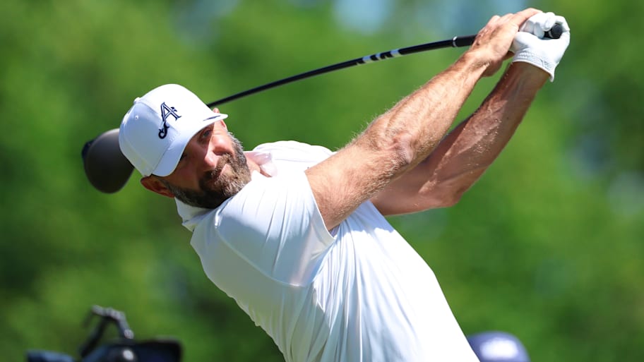 Dustin John.son plays a tee shot on hole 2 during a practice round of the PGA Championship 