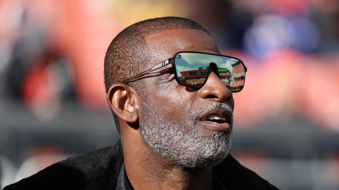 Dec 21, 2025; Cleveland, Ohio, USA;  Legendary  football and baseball player and father of Cleveland Browns quarterback Shedeur Sanders, Deion Sanders on the sidelines prior to a game against the Buffalo Bills at Huntington Bank Field. 
