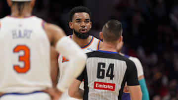 Mar 20, 2025; Charlotte, North Carolina, USA; New York Knicks center Karl-Anthony Towns (32) reacts to a technical foul call by referee Justin Van Duyne (64) during the second half against the Charlotte Hornets at Spectrum Center. Mandatory Credit: Jim Dedmon-Imagn Images