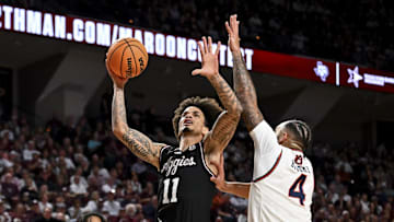 Mar 4, 2025; College Station, Texas, USA; Texas A&M Aggies forward Andersson Garcia (11) shoots the ball as Auburn Tigers forward Johni Broome (4) defends during the first half at Reed Arena. Mandatory Credit: Maria Lysaker-Imagn Images 