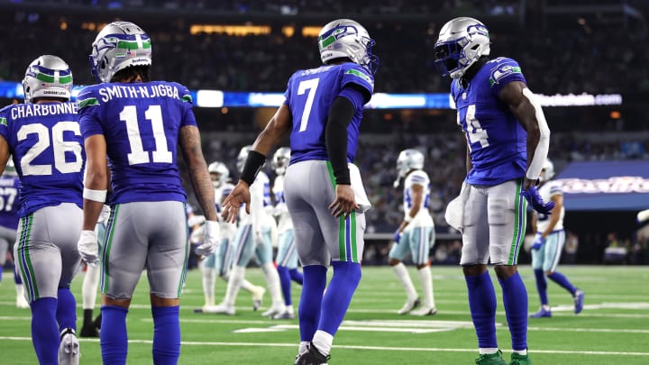 Nov 30, 2023; Arlington, Texas, USA; Seattle Seahawks wide receiver DK Metcalf (14) celebrates with quarterback Geno Smith (7) after scoring a touchdown  against the Seattle Seahawks during the second half at AT&T Stadium. Mandatory Credit: Tim Heitman-USA TODAY Sports