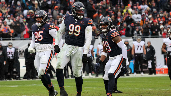 Gevon Dexter celebrates with DeMarcus Walker (left) and Tremaine Edmunds (right) after knocking down a pass last year. 